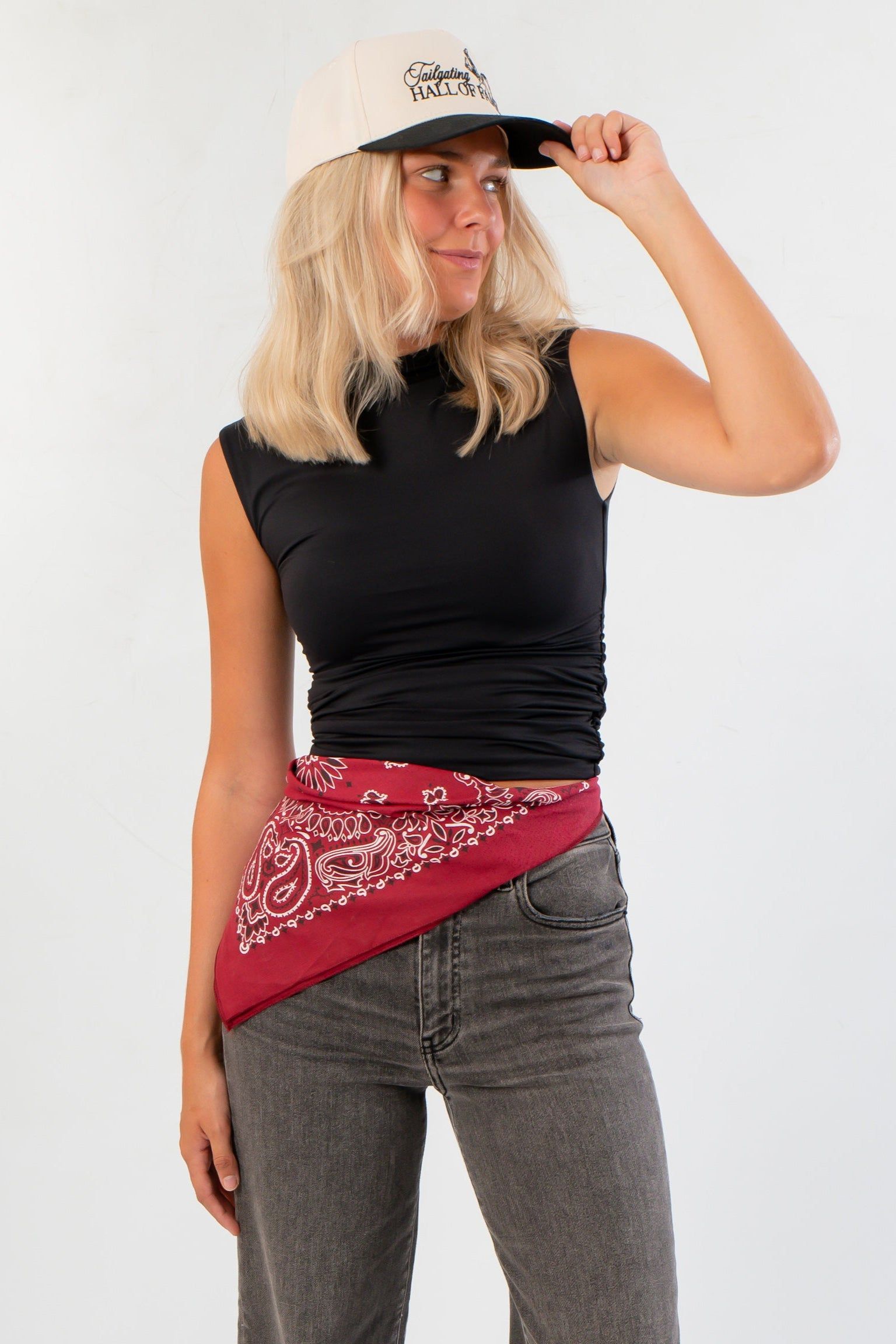 Luck Of The Draw Black Ruched Funnel Neck Tank – Sleek Fit styled with grey jeans and red bandana, featuring a sleeveless ruched design.