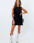 all black gameday outfit with fun feather applique paired with silver boots for a night game
