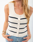 Close-up of Z Supply Sycamore Sea Salt Stripe Sweater Vest highlighting its ribbed knit texture, navy stripes, and button-down front for a vintage-inspired look.