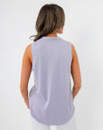 Back view of Lavender Mist V-Neck Sleeveless Drape Top in soft pastel purple, ideal for spring layering and dressy casual outfits.