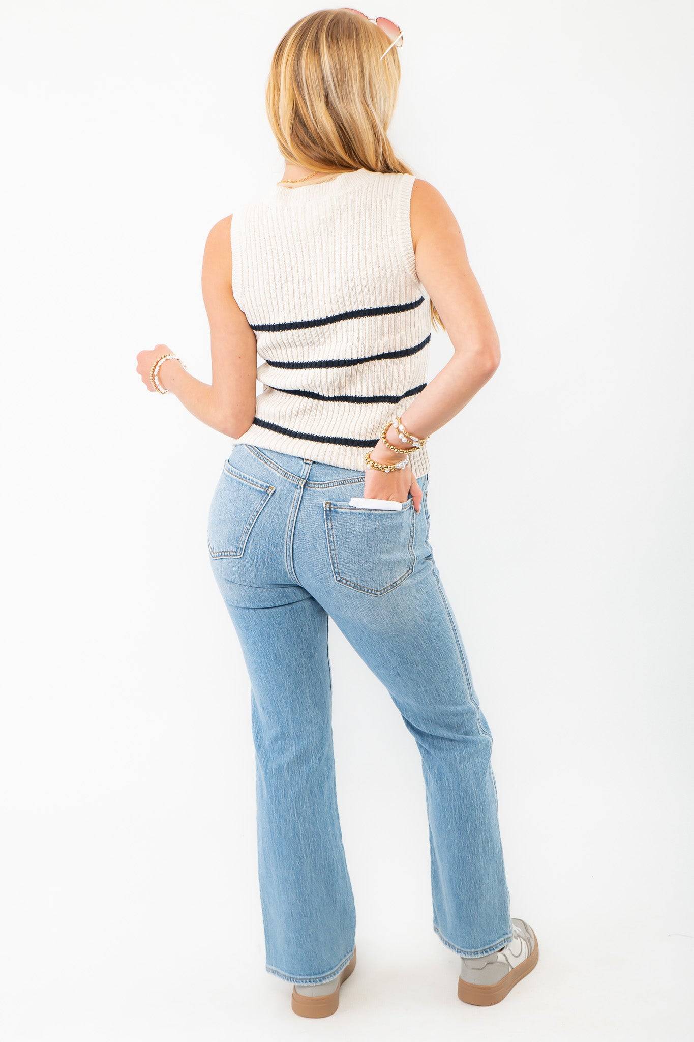 Back view of Z Supply Sycamore Sea Salt Stripe Sweater Vest, displaying its sleeveless design and striped knit pattern, perfect for layering in any season.