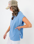 Side view of Camila Powder Blue Knit Top showing side slit detail and relaxed fit, perfect for layering or standalone spring looks.