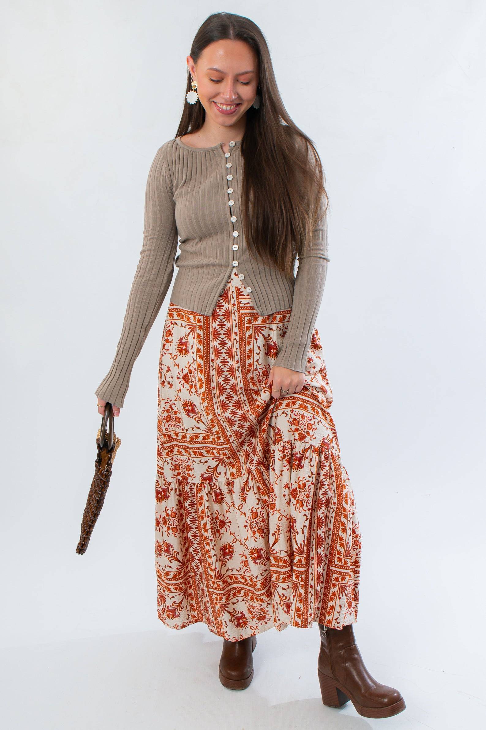 Burnt Orange Floral Patterned Midi Skirt styled with taupe ribbed cardigan and brown boots. Perfect fall style for casual outings.