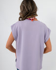 Back view of Camila Lavender Knit Top highlighting its flowy silhouette and textured knit fabric for spring wear.