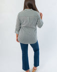Back view of Dark Green Striped Button Down blouse showing yoke detail and long hem, perfect for stylish fall office wear.