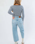 Back view of Before You Go Blue Stripe Long Sleeve Crop Top showing ribbed knit design and snug fit, paired with high-rise jeans and ankle boots.