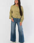 Relaxed and stylish Free People Whispering Willow Lila Cardigan paired with wide-leg jeans, ideal for cozy fall outfits.