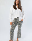 Chic and comfortable Rylee White Oversized Button Down Shirt paired with animal print trousers, ideal for casual or office outfits.