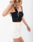Side angle of Black Square Neck Smocked Brami - Stylish & Comfy Top styled with cream shorts, perfect for casual or lounge wear.