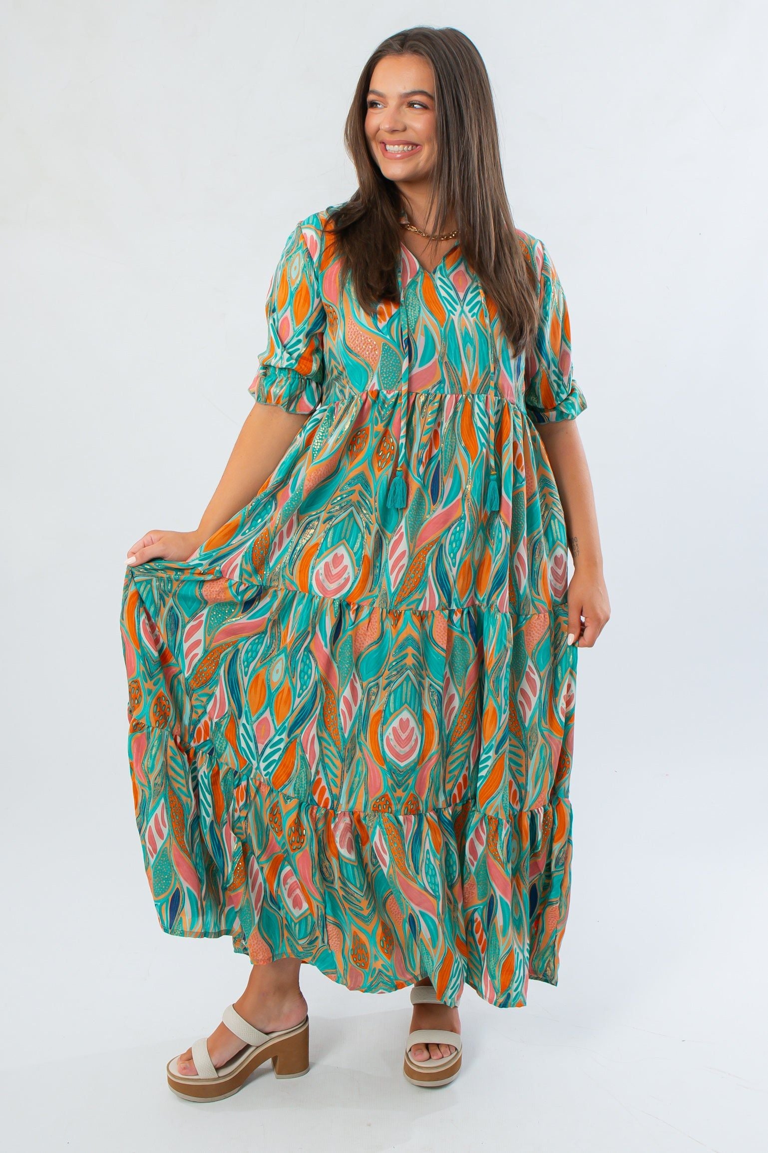 Mahi Maxi Dress in sea foam green with puff sleeves and tiered skirt, featuring a vibrant patterned design ideal for summer occasions.