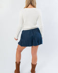 Back view of Cream Cable Knit Button Front Cardigan – Cozy Fall Essential highlighting ribbed knit detail and cropped length for fall layering.