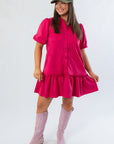 Berry Suede Puff Sleeve Mini Dress with collared neckline and ruffled hem, styled for fall with pink boots and a green cap.