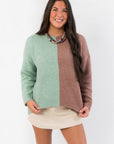 Road Ahead Mint & Brown Colorblock Sweater with oversized fit and crew neck, styled with a beige mini skirt for cozy fall fashion.