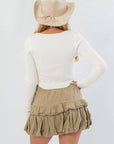 Back view of Before You Go Cream Long Sleeve Crop Top – Chic & Comfortable showing ribbed texture and cropped fit, ideal for layering with skirts or jeans.