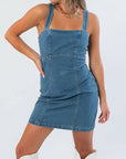 Close-up of Karli Denim Corset Back Mini Dress showing structured seams and square neckline, ideal for fall gameday outfits.