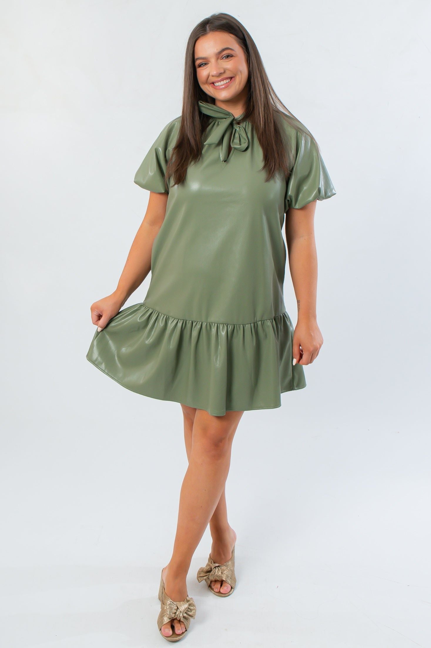 THML Avery Sage Puff Sleeve Faux Leather Mini Dress in olive green, featuring short puff sleeves and a flared mini skirt design.