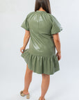 Back view of THML Avery Sage Faux Leather Mini Dress with puff sleeves and ruffle hem, ideal for stylish fall occasions.