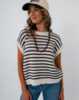 Black and White striped sleeveless sweater for neutral fall game day outfit