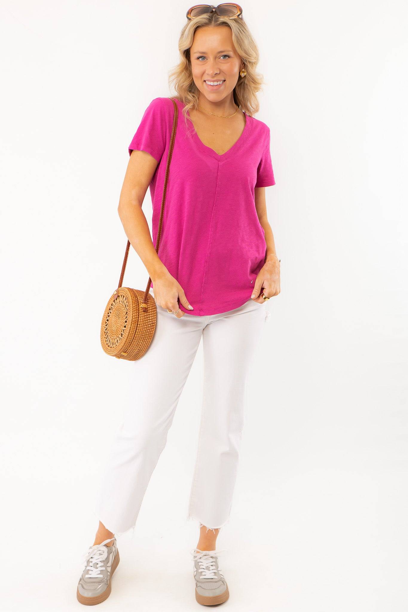 Stylish and comfortable Z Supply Magenta Asher V-Neck Tee paired with white denim and a woven bag, perfect for any season.