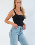 Side view of RD Style Scoop Bodysuit Black, showcasing its form-fitting, moisture-wicking fabric ideal for solo wear or layering in fall outfits.