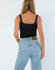 Back view of RD Style Scoop Bodysuit Black showing its smooth, fitted silhouette and wide straps, ideal for seamless layering under jackets.