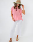 Frankie Pink Knit Sleeveless Sweater styled with white pants