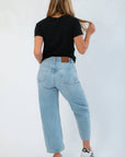 Z Supply Black Tourist Tee – Back view of relaxed fit cotton t-shirt, styled with high-rise light blue jeans and casual sneakers.