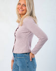 Side view of Carry On Pink & Brown Striped Button Front Top showing fitted silhouette and soft ribbed texture, ideal for fall layering.
