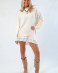 Cozy fall style featuring the Almost September Off White Cream Oversized Sweater paired with lace skirt and suede boots for a layered autumn look.