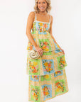Show Me Your Mumu Peyton Country Bouquet Midi Dress featuring a vibrant floral print, smocked bodice, and tiered skirt, perfect for summer outings.