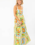 Elegant Show Me Your Mumu Peyton Country Bouquet Midi Dress with a tiered silhouette, smocked bodice, and floral print, ideal for warm-weather occasions.