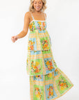 Fun and flowy Show Me Your Mumu Peyton Country Bouquet Midi Dress with a bright floral pattern, adjustable straps, and tiered layers for a breezy look.