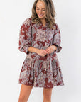 Scottie Burgundy Print Tiered Mini Dress with v neckline and balloon sleeves, featuring a boho patchwork pattern perfect for casual wear.
