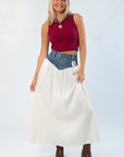 Show Me Your Mumu Denim Voile Maxi Skirt styled with a red ribbed crop top and brown boots, showcasing a chic fall outfit.