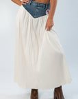 Denim Voile Maxi Skirt - Show Me Your Mumu featuring a cream pleated skirt with a denim waistband, styled with brown boots.