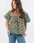 THML Green Floral Color Block Puff Sleeve Top with tie neck and puff sleeves, styled with denim for a trendy fall outfit.