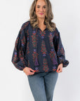 At Long Last Navy Long Sleeve Blouse with vintage floral balloon sleeves and smocked shoulders, styled for fall in a casual front pose.