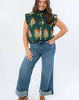 Front view of THML Dark Green Ruffle Sleeve Block Floral Print Blouse featuring button front and floral design, ideal for workwear or casual outings.