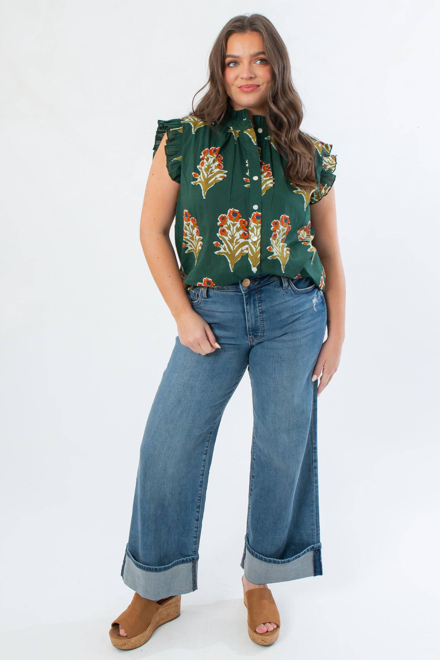 THML Dark Green Ruffle Sleeve Block Floral Print Blouse with flutter sleeves and high neck, styled with wide-leg cuffed jeans for fall fashion.