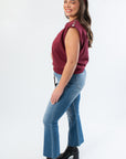 Side view of THML Burgundy Studded Sleeveless Top highlighting structured shoulders and metallic studs.