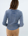 Blue henley top with ribbed fabric and button detailing, blue ribbed long sleeve shirt, blue ribbed henley, blue long sleeve shirt with floral detailing