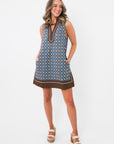 Maureen Chambray Medallion Shift Dress – Floral Sleeveless V Neck with blue and brown medallion print, styled with white platform sandals.