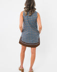 Back view of Maureen Chambray Medallion Shift Dress – Floral Sleeveless V Neck with allover medallion print and brown border trim.