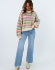 Patterned knit sweater
Soft pink and green striped sweater