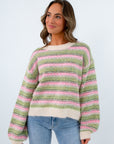 Cozy ivory sweater with pink and green striped design, striped long sleeve sweater