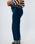 Women’s wide leg jeans featuring fading and seaming details, women's jeans with ankle cuff, women's cropped jeans in dark wash