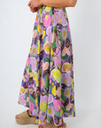 Close-up of floral maxi skirt with pink, purple, and yellow flowers