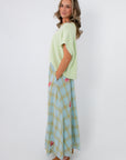 Elegant plaid midi skirt with colorful embellishments for spring