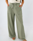 Close-up of women's sage green ribbed lounge pants with drawstring waist