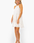 Side view of Antique Floral Halter Dress styled with nude heels, showcasing its flowy fit and elegant bridal appeal for summer events.